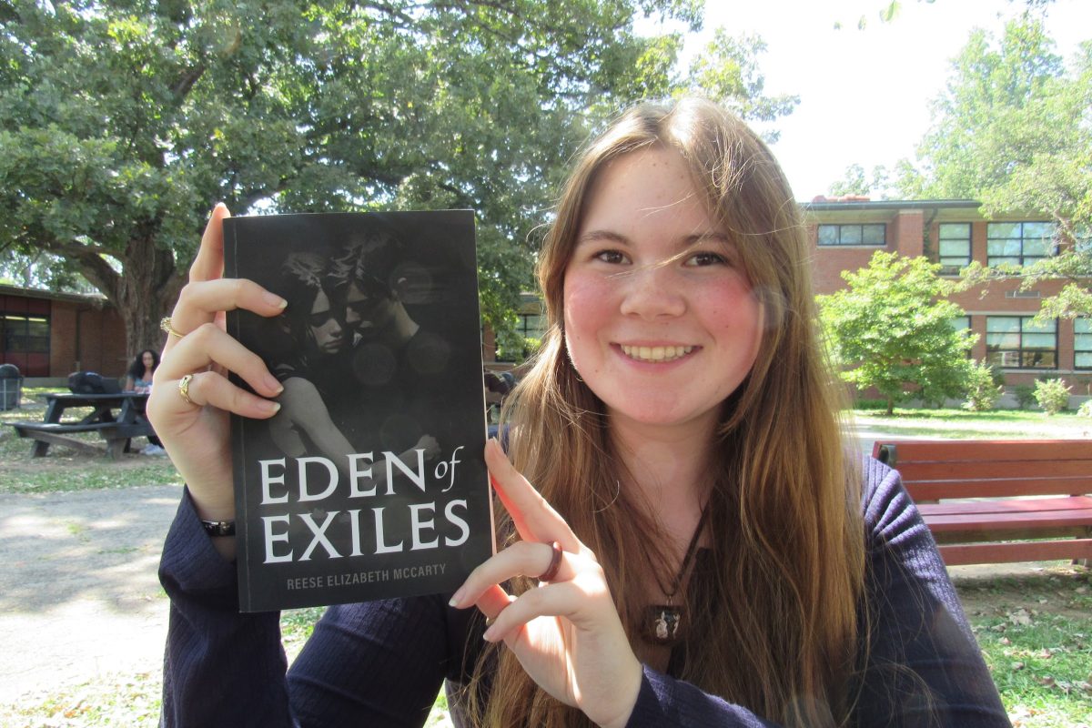 Reese McCarty, 11, pictured with her self published debut novel, Eden Of Exiles