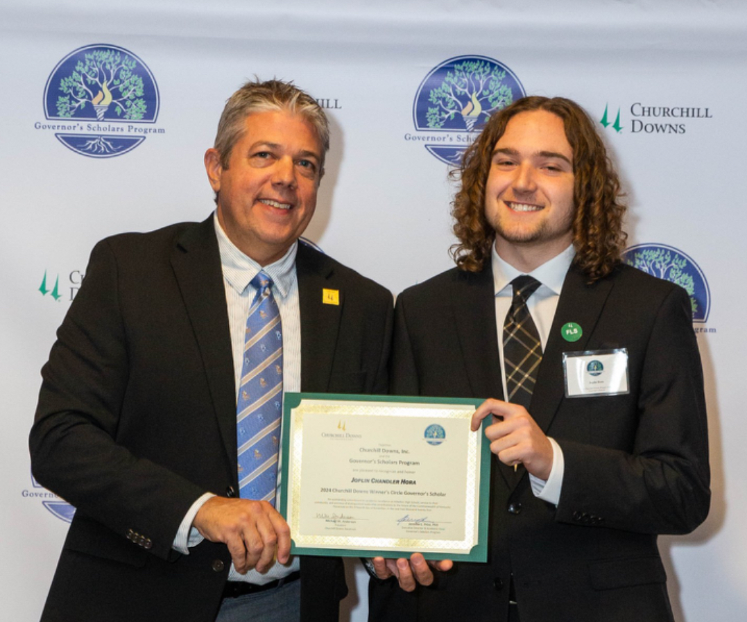 Joplin Hora (right) receives his Winner Scholars Certificate. 