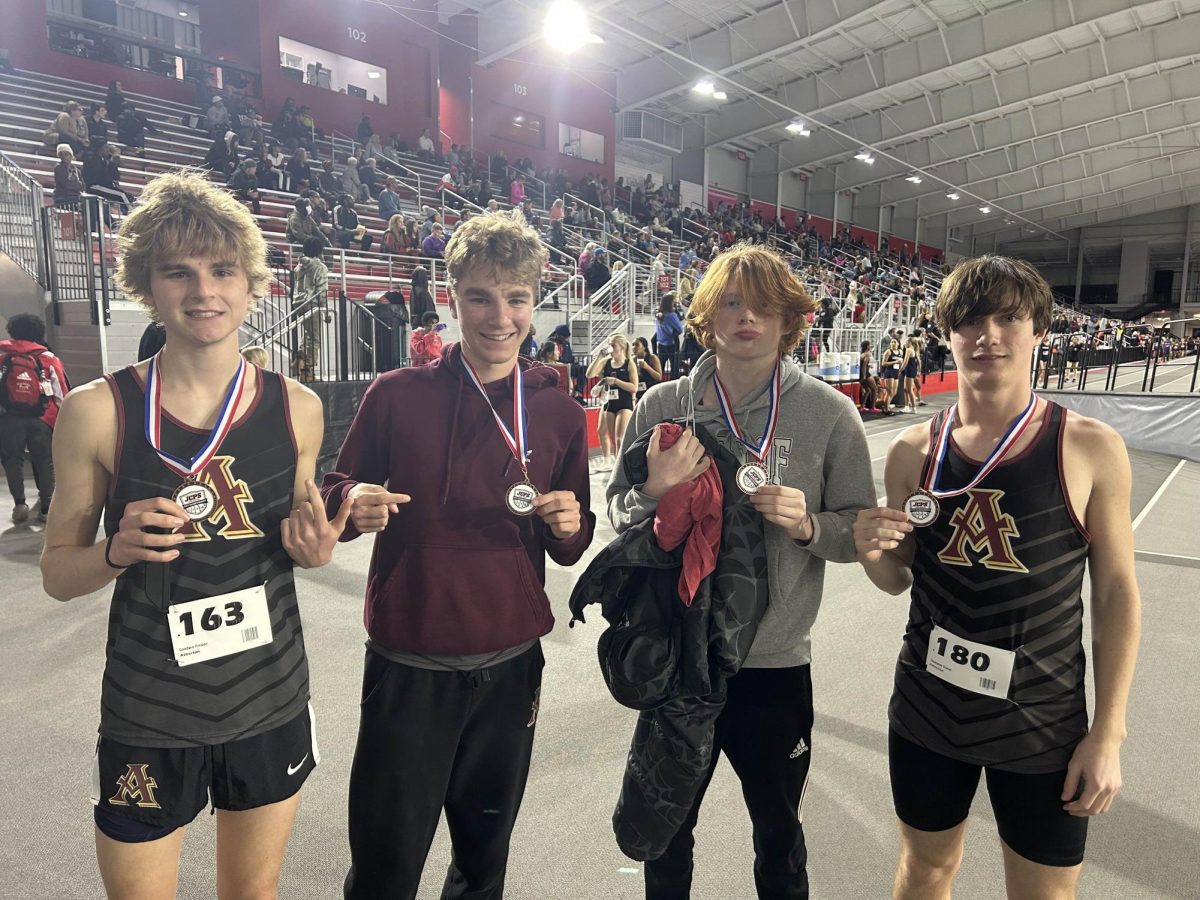 Preston Goodwin, Nate Cello, Otis Selbig, and Daniel Thompson with their medals