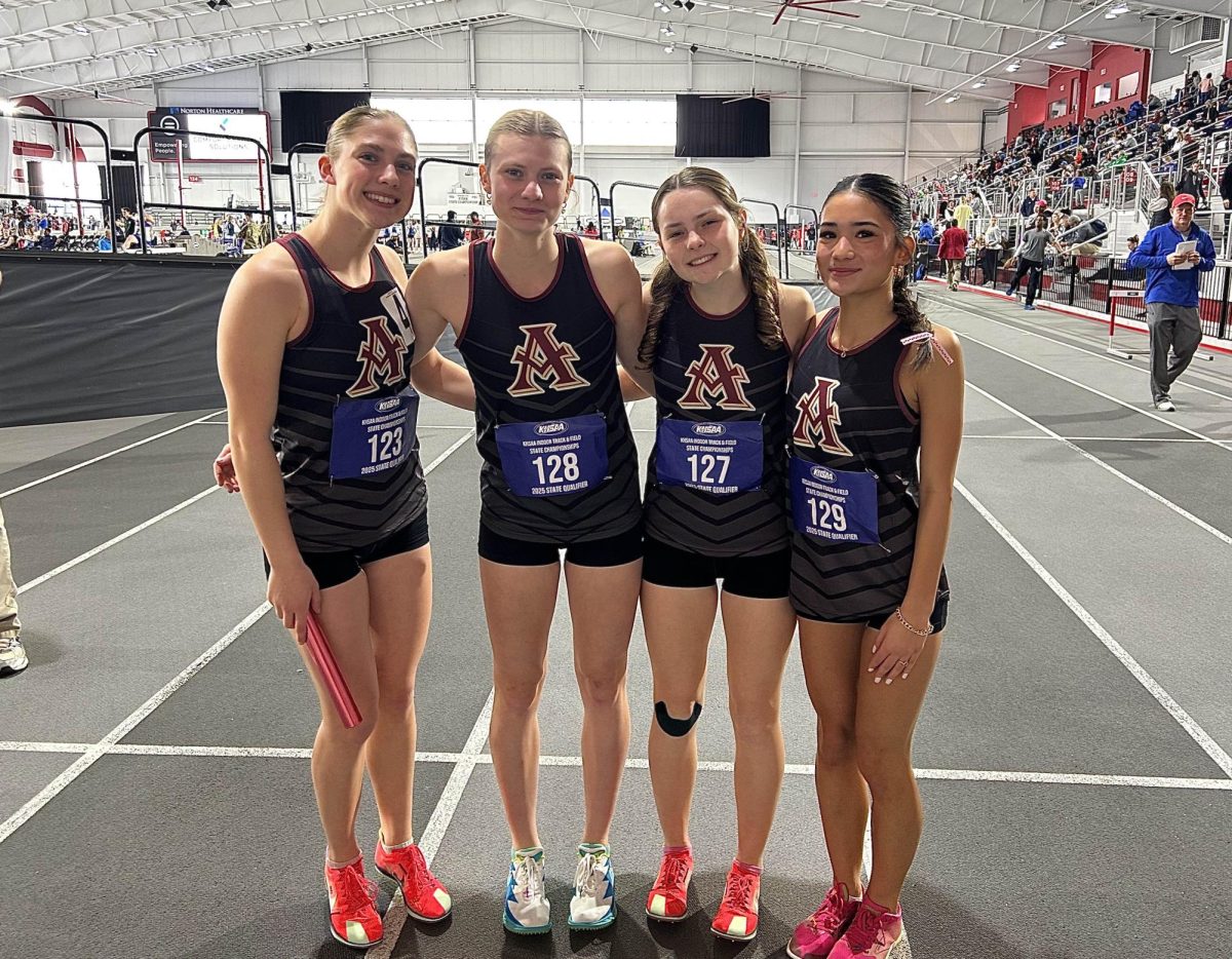 Lillian Borkowski, Elise France, Wesley Drakę, and Ava Llaguno before the 800m.