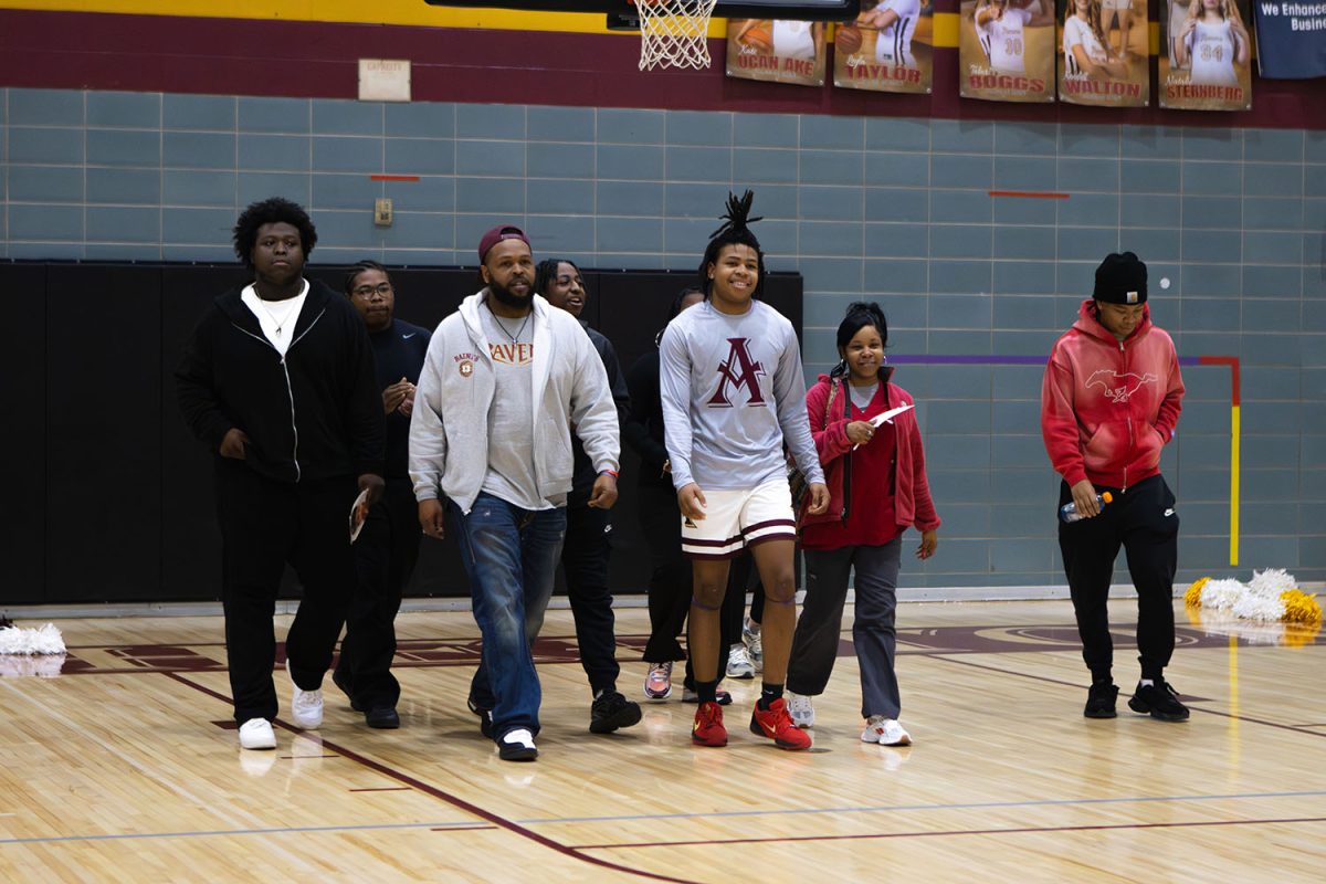 Quilshaun Baines walking with his family.