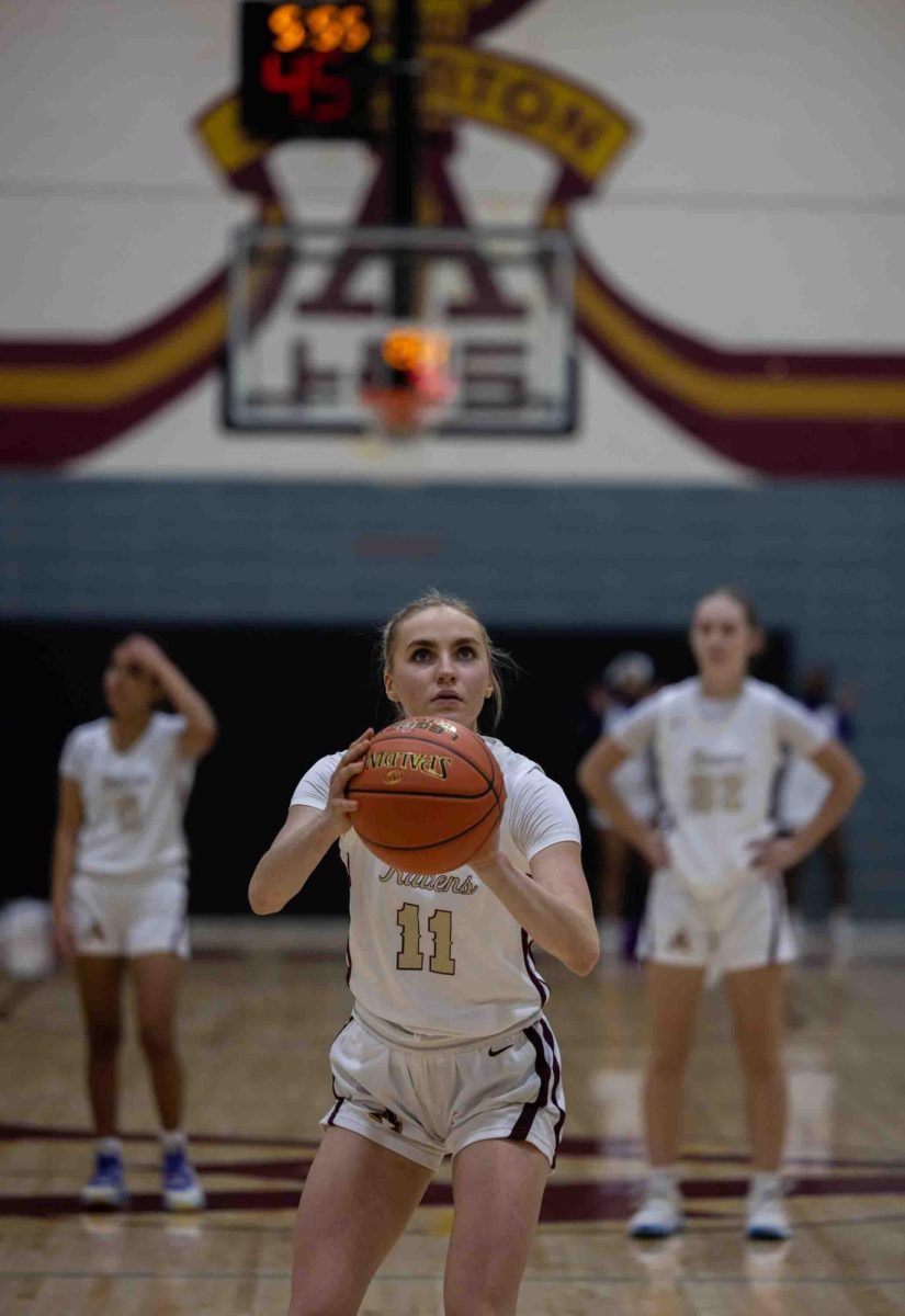 Tabor Boggs, 12, focusing on making a free throw.