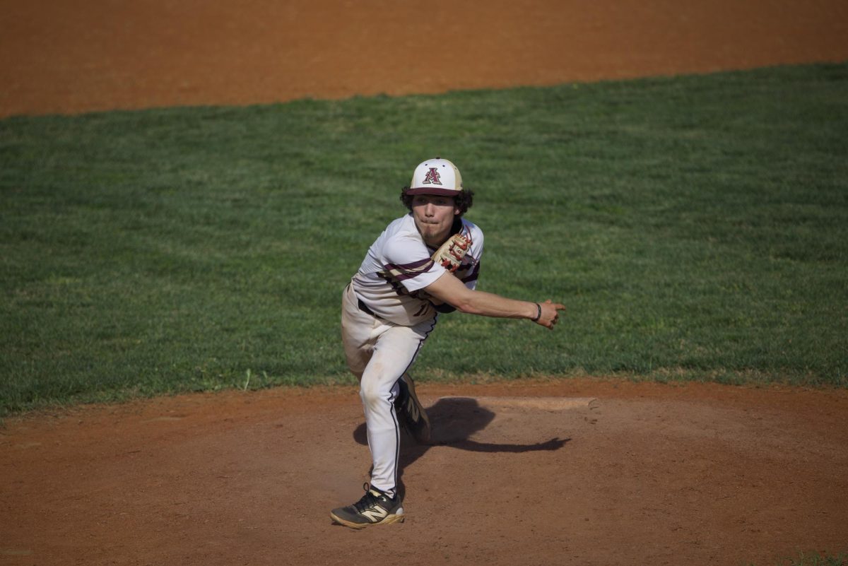 Jude Fulks (12) throws a pitch